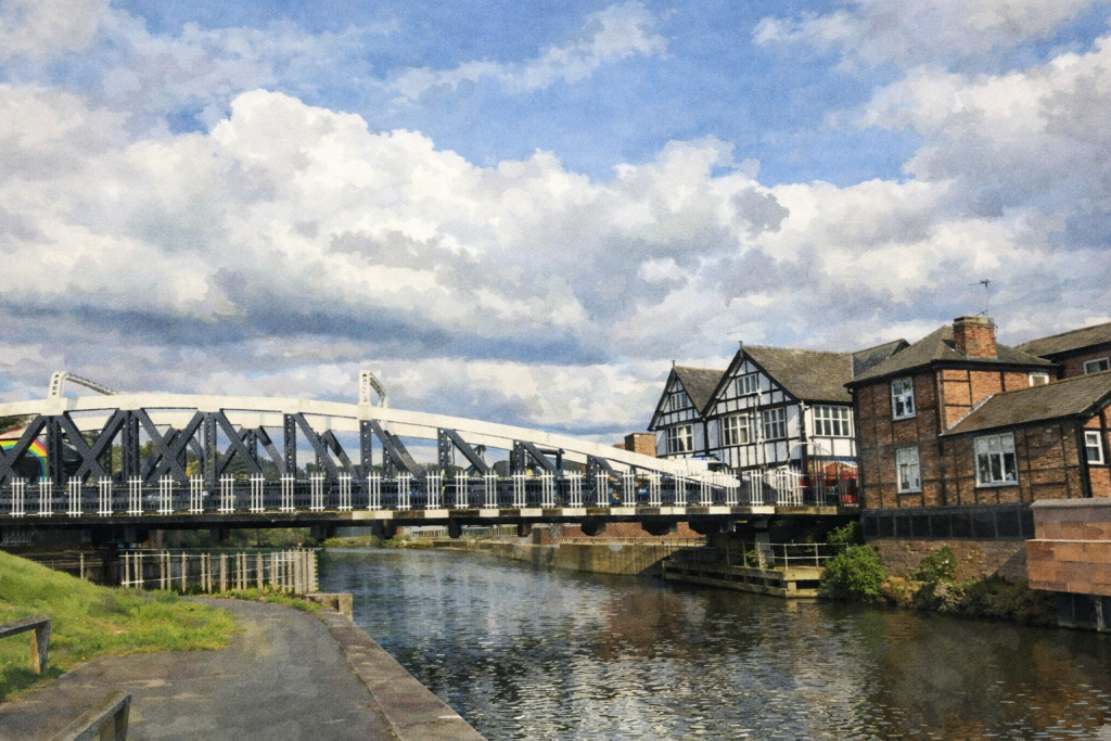 Watercolour painting of a white metal truss bridge crossing a calm canal beside brick and Tudor-style buildings under a partly cloudy sky.